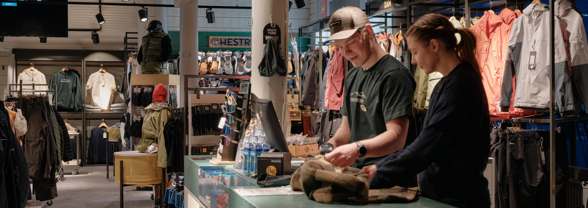 Two women sit at the top of the mountain